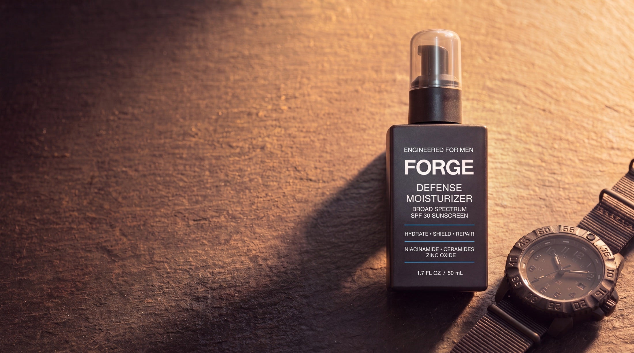 FORGE Defense Moisturizer on stone in warm light